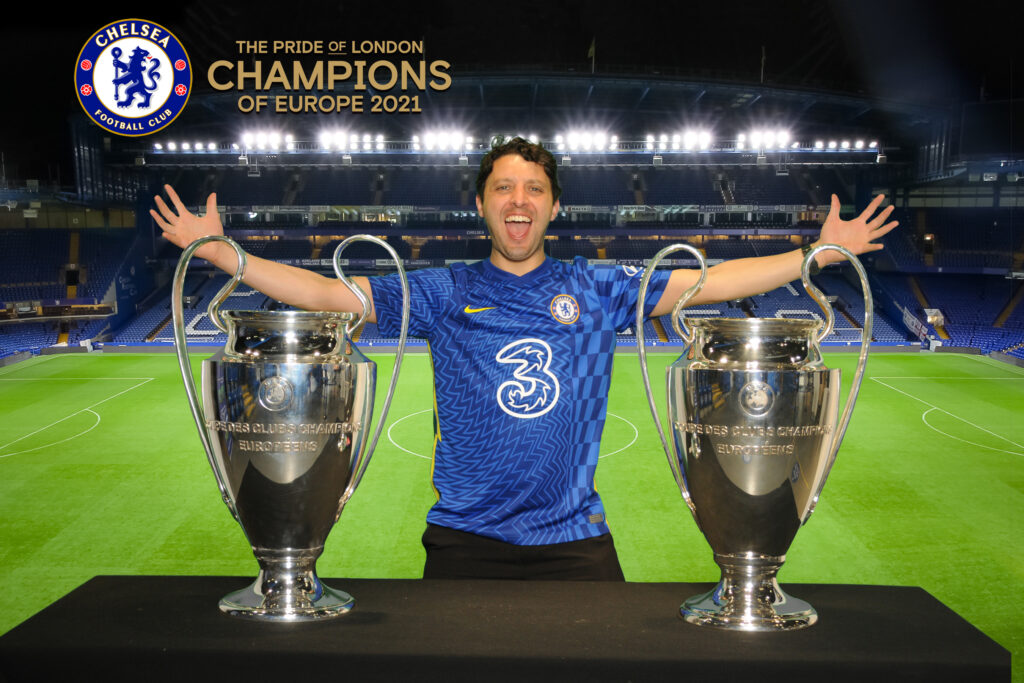 Chelsea Football Club image of guest with the football club trophy.