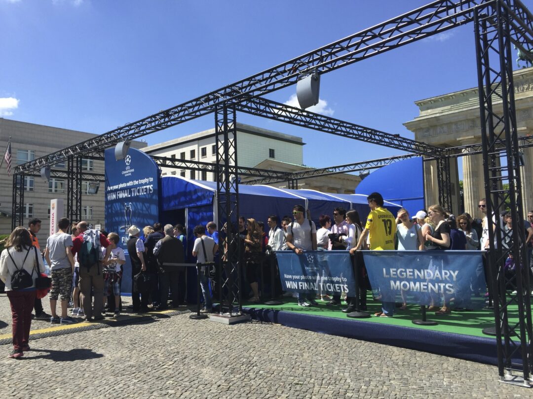 UEFA Champions League Final - Berlin - Image of people queing to take photo with trophy.