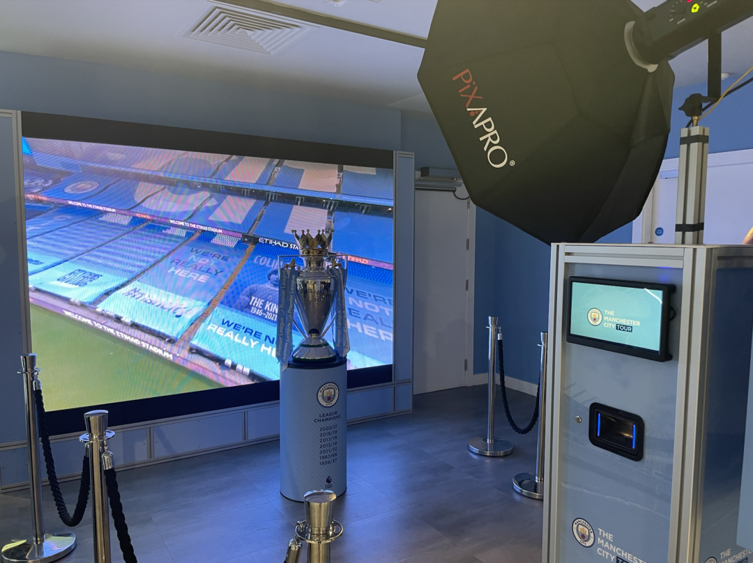 Image of Manchester trophy infront of green screen.