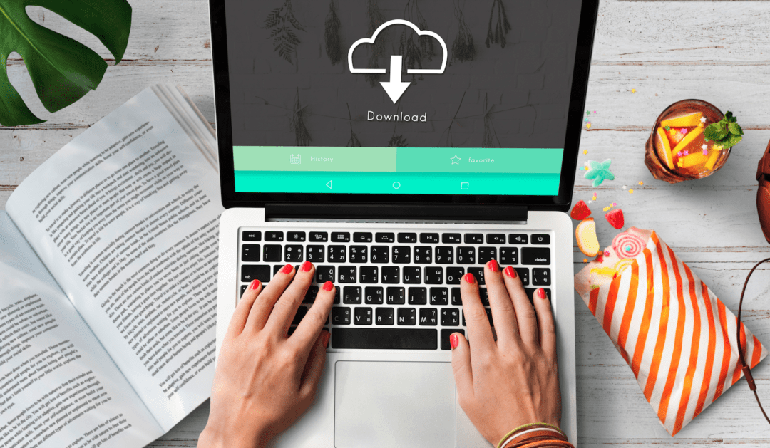 Banner Image of Laptop at desk and hands resting on keys.
